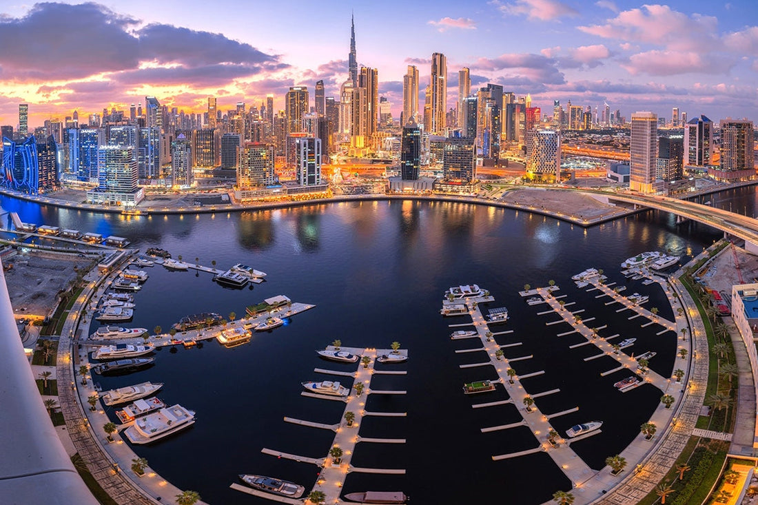 Luxury waterfront properties and skyscrapers in Dubai Marina at sunset, showcasing the real estate investment potential for foreign buyers in the UAE.